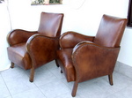Genuine art deco leather armchairs.